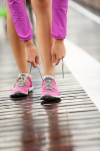 Financial peace of mind, forgiging, woman tying marathon shoes © Maridav - Fotolia.com